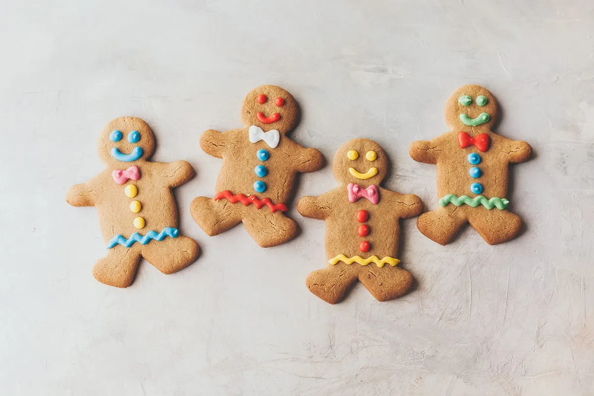 Iced gingerbread people on a tray.