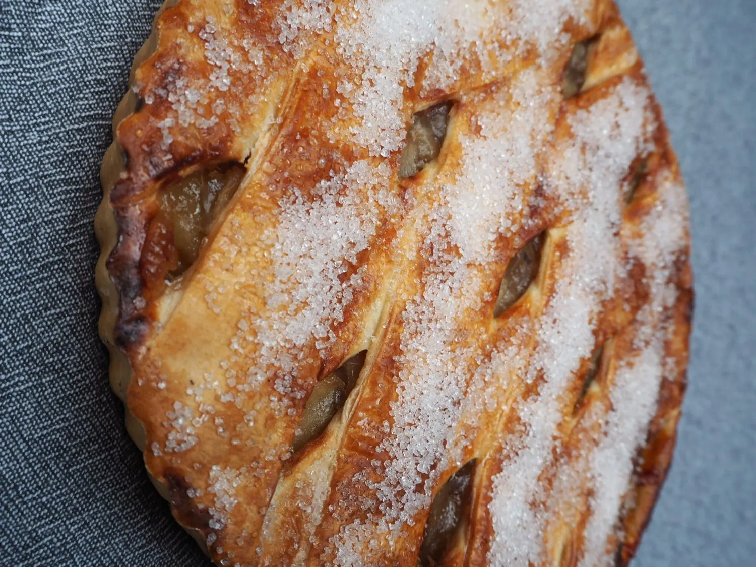 A sugar dusted lattice topped apple slice.